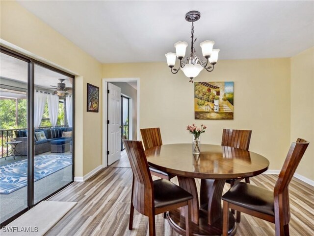 6030 Birnam Wood Ln, Fort Myers, FL 33908 - dining space featuring a chandelier, light wood-style flooring, and baseboards