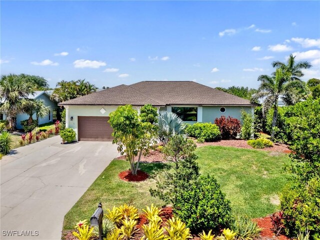 6030 Birnam Wood Ln, Fort Myers, FL 33908 - ranch-style house featuring a garage, driveway, a front lawn, and stucco siding