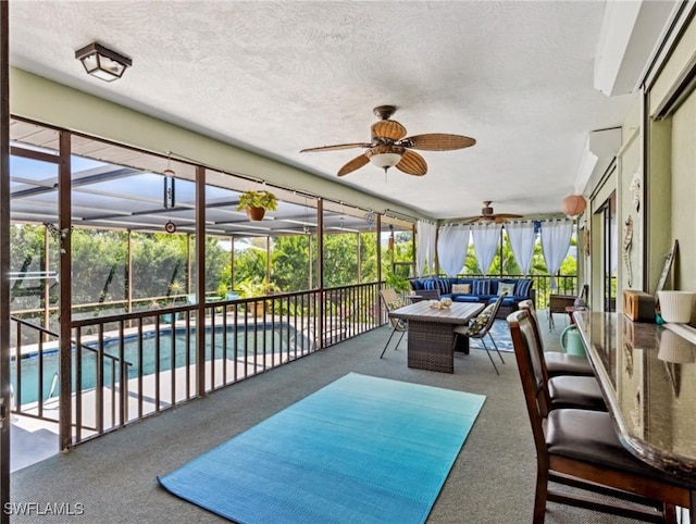 6030 Birnam Wood Ln, Fort Myers, FL 33908 - sunroom featuring an outdoor living space and a ceiling fan