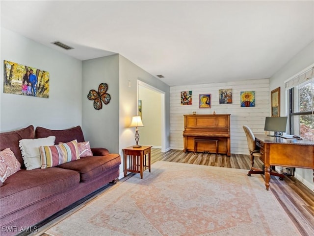 6030 Birnam Wood Ln, Fort Myers, FL 33908 - living area featuring baseboards, wood finished floors, and visible vents