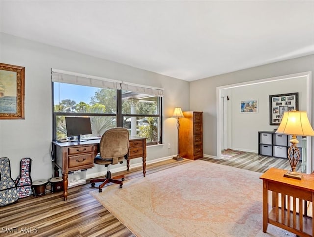 6030 Birnam Wood Ln, Fort Myers, FL 33908 - office area with baseboards and wood finished floors