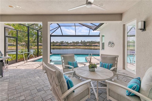 16733 Gilroy St, Bonita Springs, FL 34135 - view of patio with ceiling fan, an outdoor pool, a water view, and glass enclosure