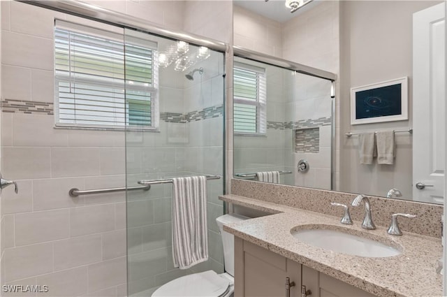 16733 Gilroy St, Bonita Springs, FL 34135 - bathroom featuring a shower stall, toilet, and vanity