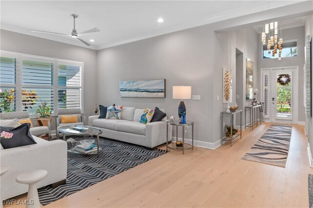16733 Gilroy St, Bonita Springs, FL 34135 - living area with wood finished floors, a chandelier, baseboards, recessed lighting, and a ceiling fan