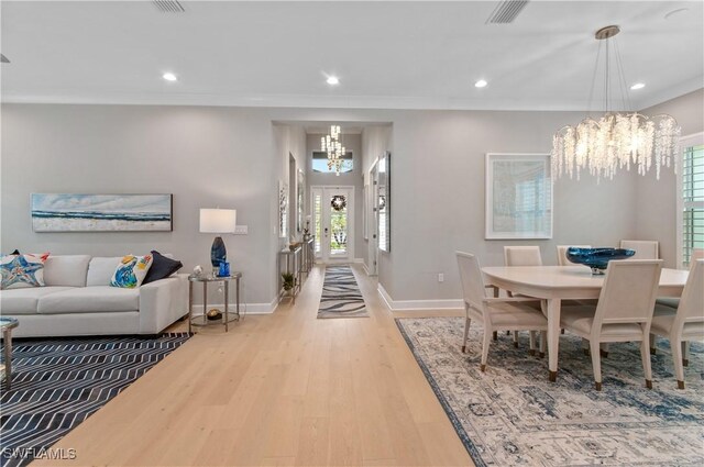 16733 Gilroy St, Bonita Springs, FL 34135 - dining room featuring a chandelier, baseboards, wood finished floors, and recessed lighting