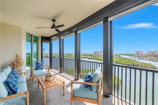 420 Cove Tower Dr Unit 804, Naples, FL 34110 - sunroom featuring a water view and ceiling fan