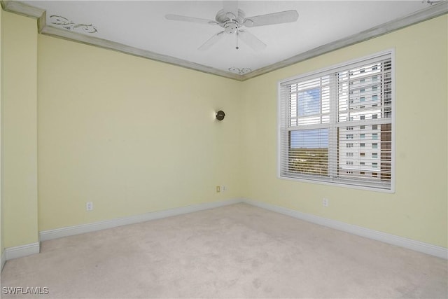 420 Cove Tower Dr Unit 804, Naples, FL 34110 - spare room featuring ornamental molding, light carpet, baseboards, and a ceiling fan