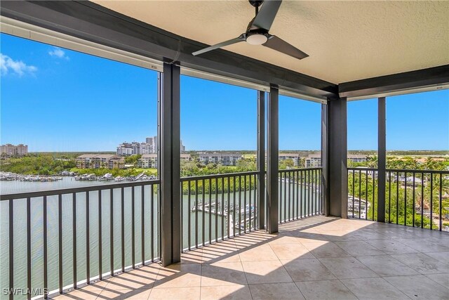 420 Cove Tower Dr Unit 804, Naples, FL 34110 - balcony featuring a water view, a ceiling fan, and a city view