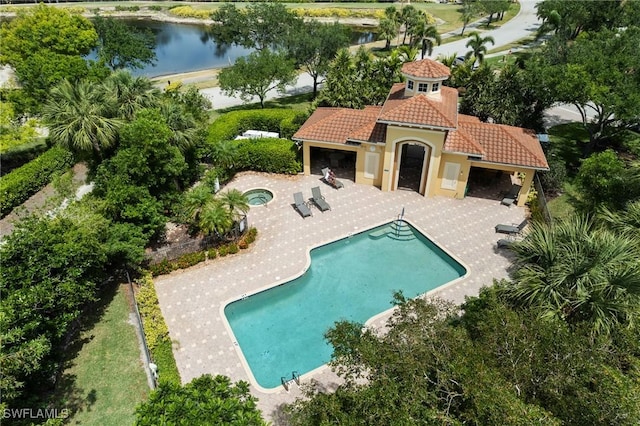 18580 Sandalwood Pointe Unit 101, Fort Myers, FL 33908 - community pool with a patio, a community hot tub, and a water view