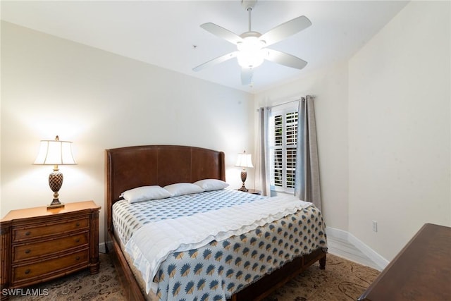 18580 Sandalwood Pointe Unit 101, Fort Myers, FL 33908 - bedroom featuring baseboards, wood finished floors, and a ceiling fan