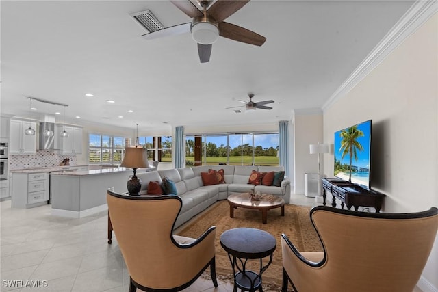 18580 Sandalwood Pointe Unit 101, Fort Myers, FL 33908 - living room featuring visible vents, light tile patterned floors, ceiling fan, and crown molding