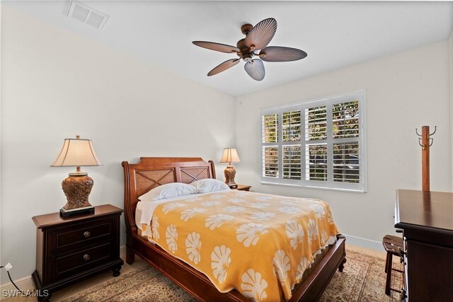 18580 Sandalwood Pointe Unit 101, Fort Myers, FL 33908 - bedroom with visible vents, ceiling fan, and baseboards