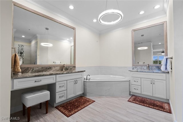 18580 Sandalwood Pointe Unit 101, Fort Myers, FL 33908 - full bathroom featuring a garden tub, vanity, recessed lighting, and ornamental molding