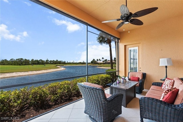 18580 Sandalwood Pointe Unit 101, Fort Myers, FL 33908 - sunroom featuring a ceiling fan and a water view