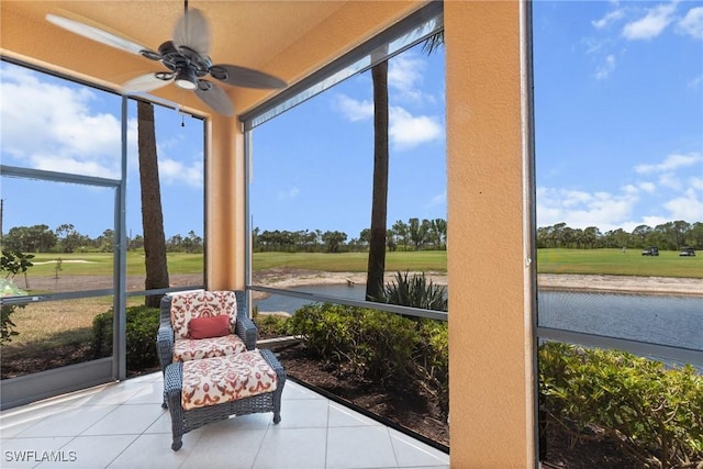 18580 Sandalwood Pointe Unit 101, Fort Myers, FL 33908 - sunroom with ceiling fan, golf course view, and a water view