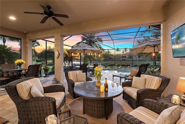 view of patio featuring ceiling fan, an outdoor pool, an outdoor living space, glass enclosure, and outdoor dining space