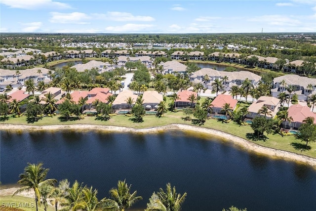 birds eye view of property featuring a residential view and a water view