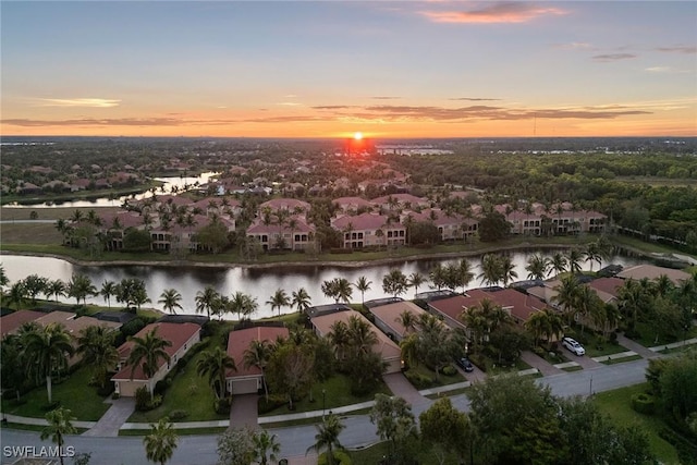 bird's eye view with a water view and a residential view