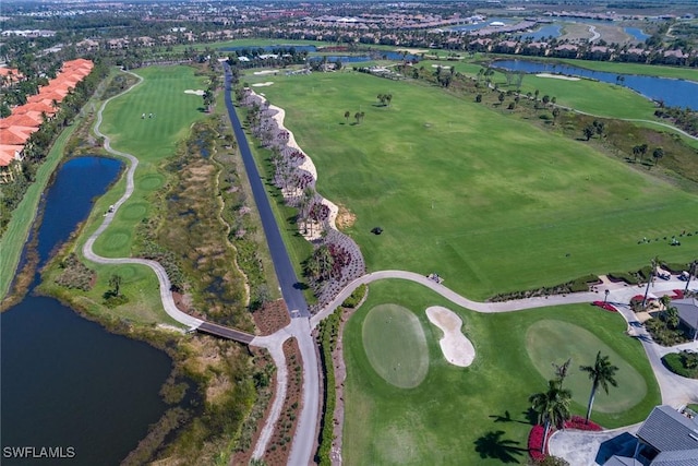 aerial view with view of golf course and a water view