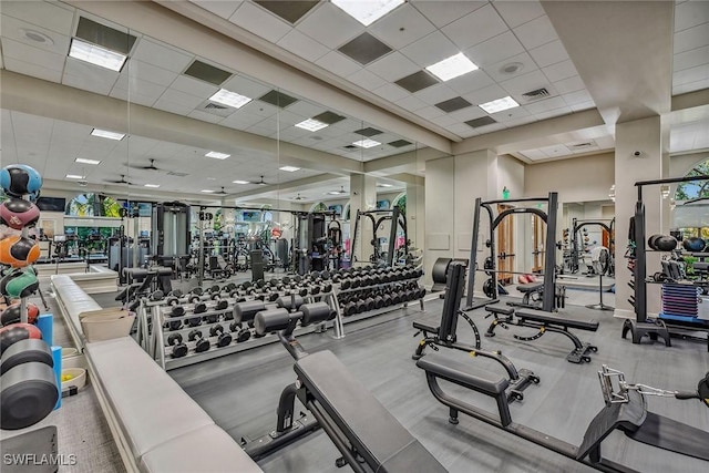 workout area featuring visible vents and a drop ceiling