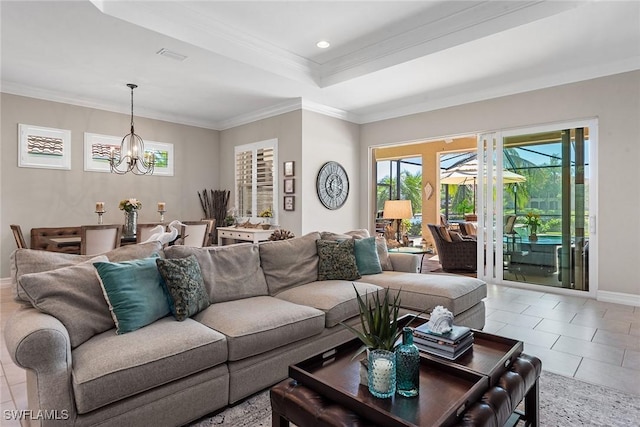 living area with an inviting chandelier, a wealth of natural light, and tile patterned flooring