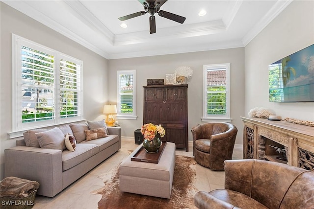 living area featuring crown molding, ceiling fan, a raised ceiling, tile patterned flooring, and recessed lighting