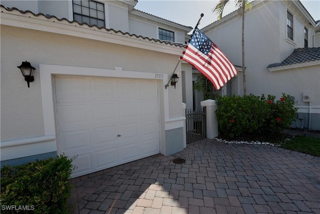 exterior space featuring decorative driveway
