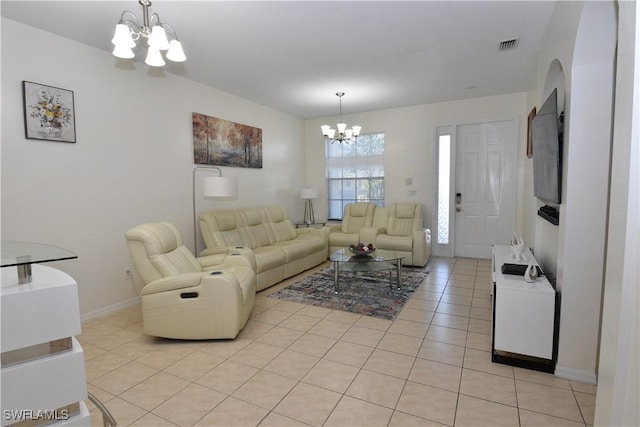 living area with baseboards, light tile patterned flooring, a chandelier, and visible vents