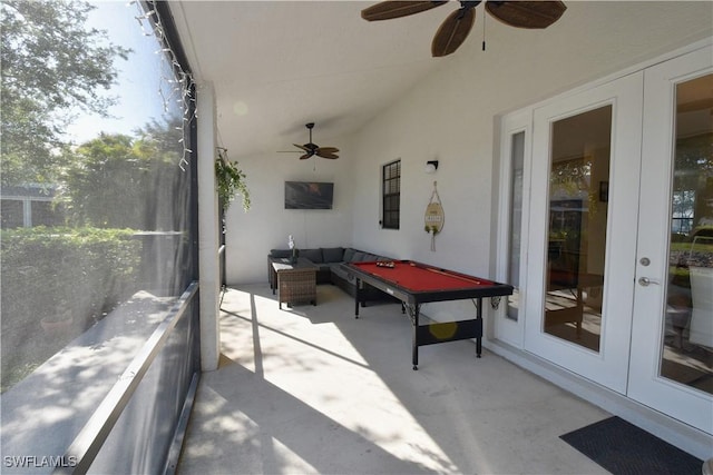 view of patio / terrace featuring an outdoor living space, ceiling fan, and french doors