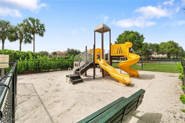communal playground featuring fence