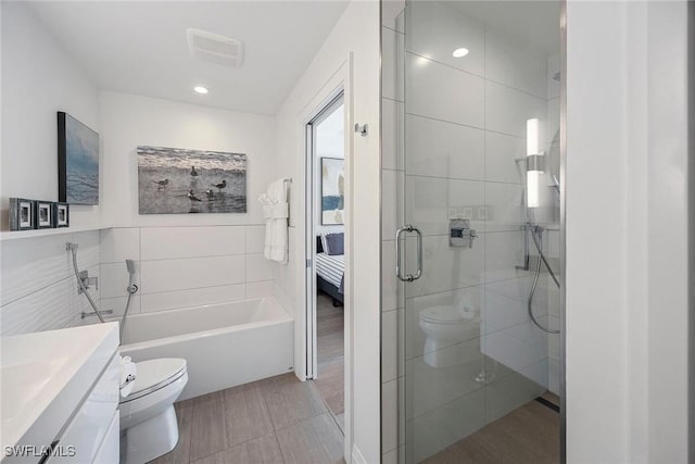 27310 Hickory Blvd, Bonita Springs, FL 34134 - bathroom with vanity, toilet, tile walls, recessed lighting, and a shower stall