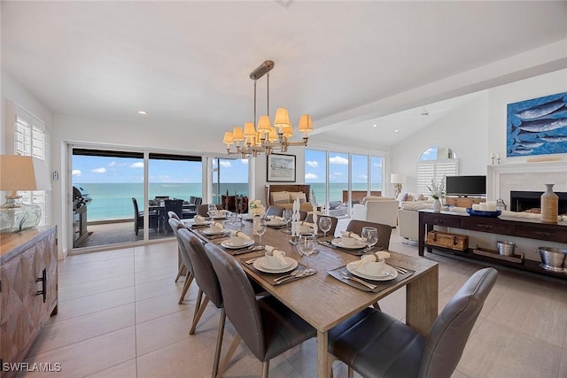 27310 Hickory Blvd, Bonita Springs, FL 34134 - dining space with an inviting chandelier, a fireplace, recessed lighting, light tile patterned floors, and vaulted ceiling