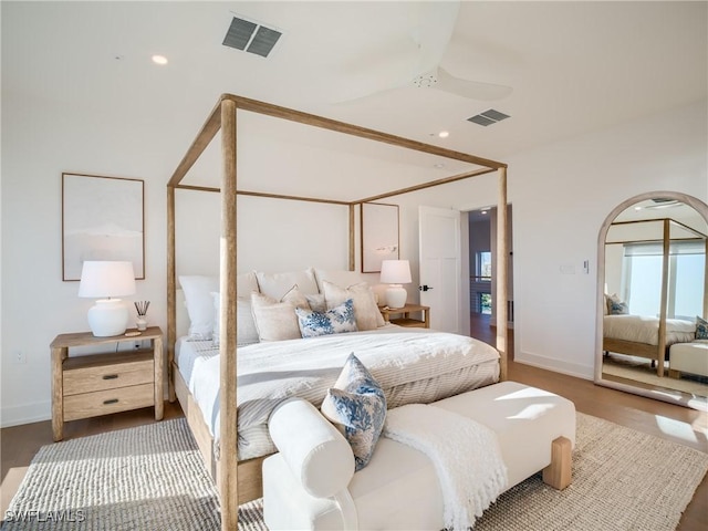 1072 S Seas Plantation Rd, Captiva, FL 33924 - bedroom with wood finished floors, arched walkways, and recessed lighting