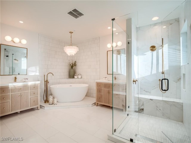 1072 S Seas Plantation Rd, Captiva, FL 33924 - full bathroom with a marble finish shower, tile walls, vanity, and a soaking tub