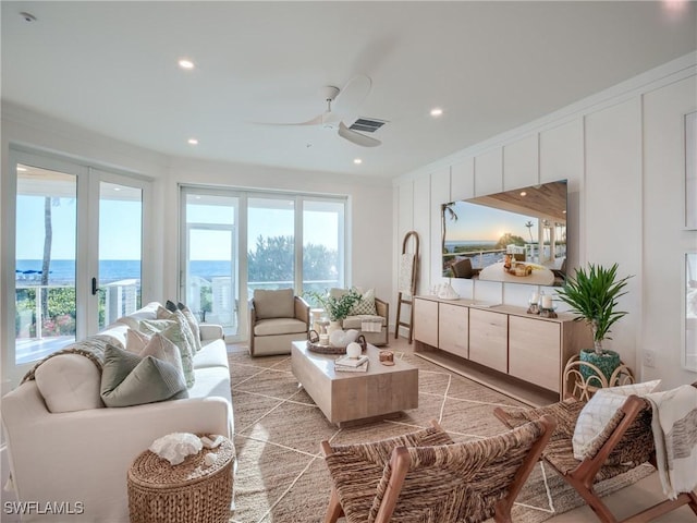 1072 S Seas Plantation Rd, Captiva, FL 33924 - living room featuring ceiling fan, recessed lighting, and a water view