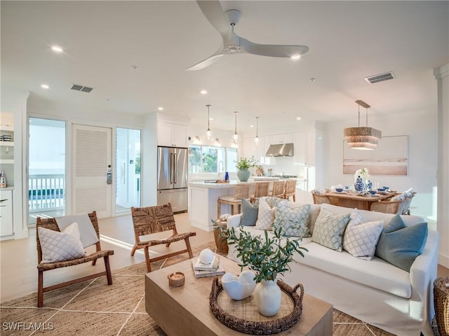 1072 S Seas Plantation Rd, Captiva, FL 33924 - living room featuring a ceiling fan and recessed lighting