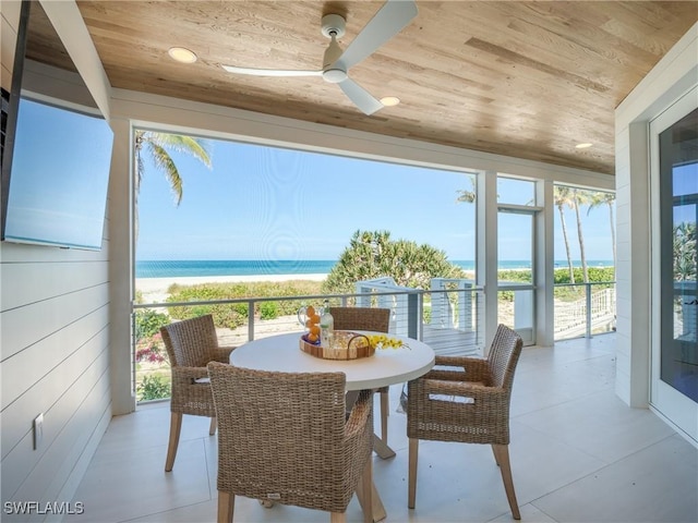1072 S Seas Plantation Rd, Captiva, FL 33924 - sunroom featuring wood ceiling, view of water and beach, and recessed lighting