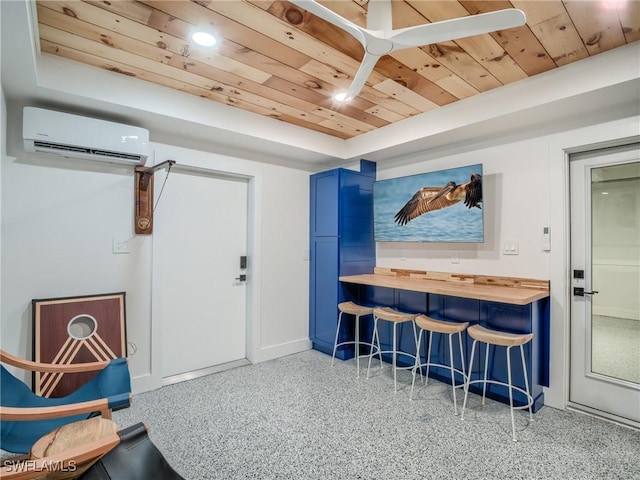 1072 S Seas Plantation Rd, Captiva, FL 33924 - living area featuring an AC wall unit, wood ceiling, speckle patterned floor, and a raised ceiling
