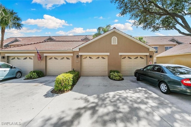 20131 Seagrove St Unit 408, Estero, FL 33928 - townhome / multi-family property featuring stucco siding, a tile roof, and community garages