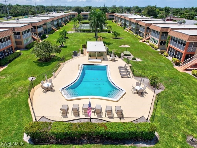 1400 Pompei Ln Unit 49, Naples, FL 34103 - community pool featuring fence and a lawn
