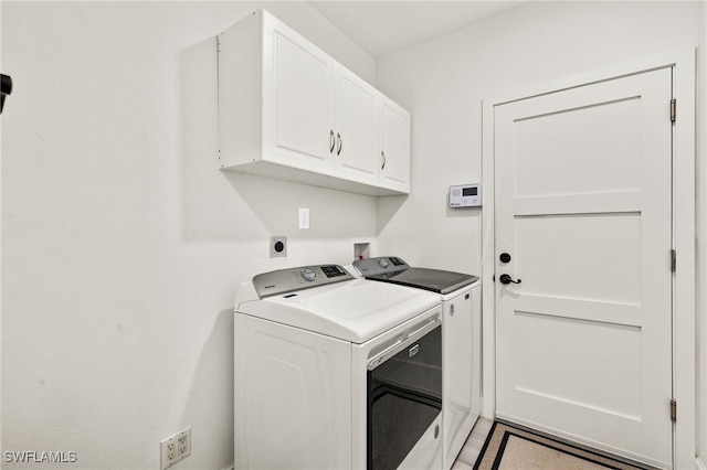 603 SW 53rd Ter, Cape Coral, FL 33914 - clothes washing area with cabinet space and independent washer and dryer