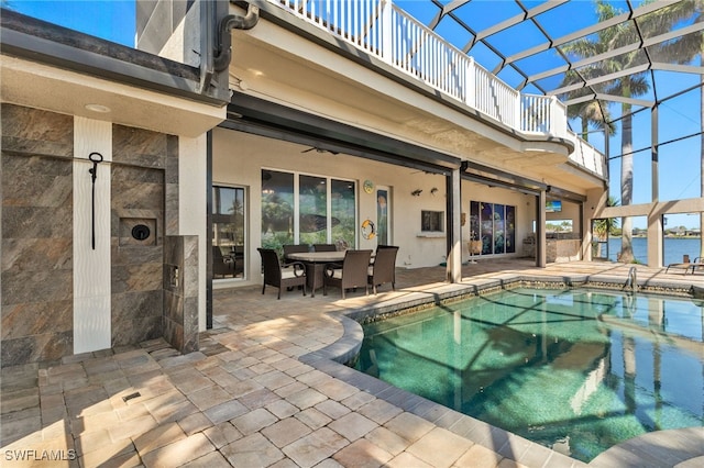 603 SW 53rd Ter, Cape Coral, FL 33914 - outdoor pool featuring outdoor dining space, a patio, and a lanai