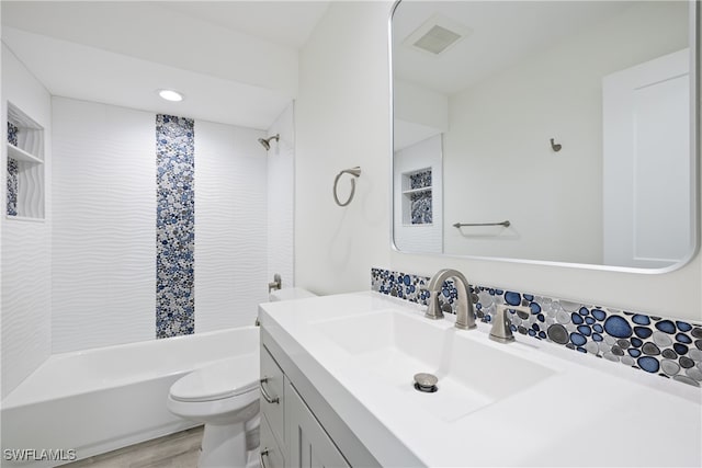 505 Mardel Dr Unit 106, Naples, FL 34104 - full bathroom featuring shower / washtub combination, toilet, vanity, and wood finished floors