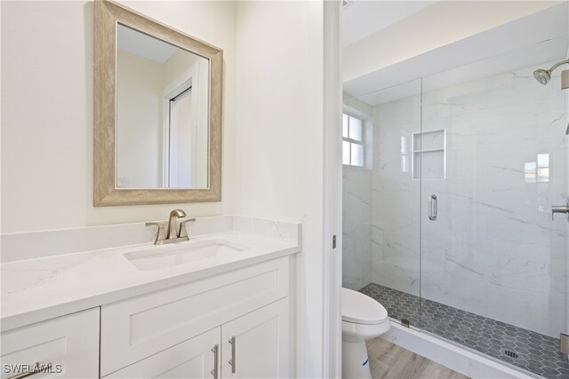 505 Mardel Dr Unit 106, Naples, FL 34104 - bathroom featuring toilet, a marble finish shower, and vanity