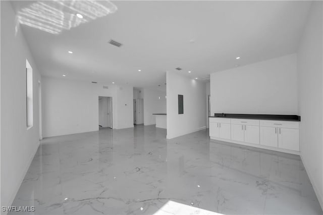 4646 Leonard Blvd S, Lehigh Acres, FL 33973 - spare room featuring light marble finish floors, baseboards, and recessed lighting