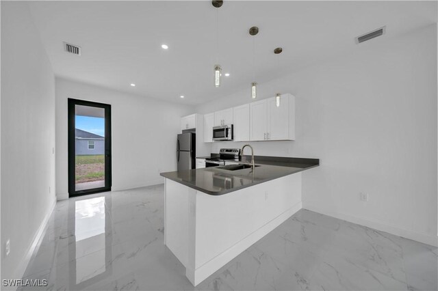 4646 Leonard Blvd S, Lehigh Acres, FL 33973 - kitchen featuring appliances with stainless steel finishes, light marble finish flooring, dark countertops, baseboards, and recessed lighting