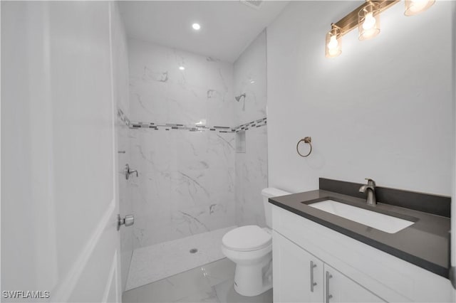 4646 Leonard Blvd S, Lehigh Acres, FL 33973 - full bath featuring marble look tile flooring, vanity, toilet, a marble finish shower, and recessed lighting