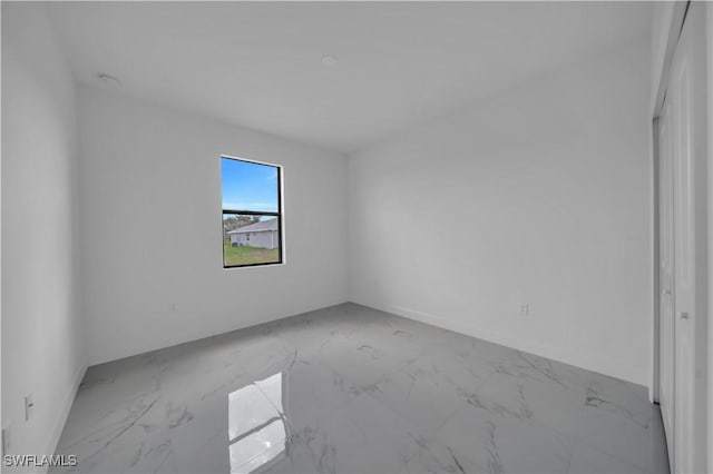 4646 Leonard Blvd S, Lehigh Acres, FL 33973 - empty room featuring marble finish floors