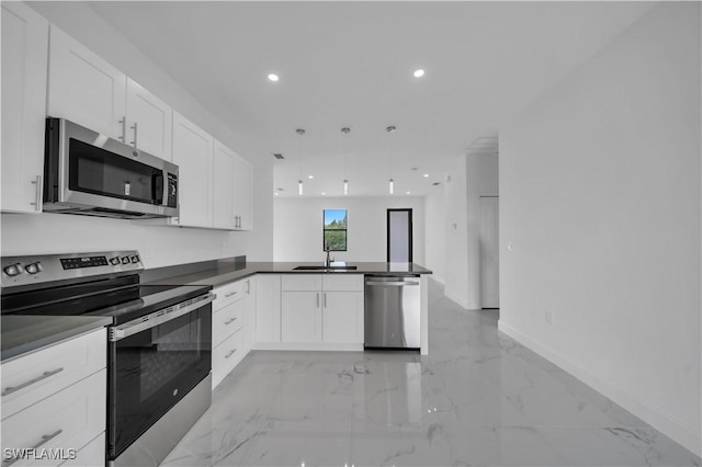 4646 Leonard Blvd S, Lehigh Acres, FL 33973 - kitchen featuring appliances with stainless steel finishes, a peninsula, recessed lighting, white cabinets, and a sink