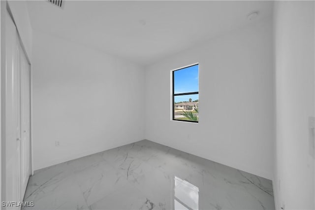 4646 Leonard Blvd S, Lehigh Acres, FL 33973 - spare room with light marble finish floors